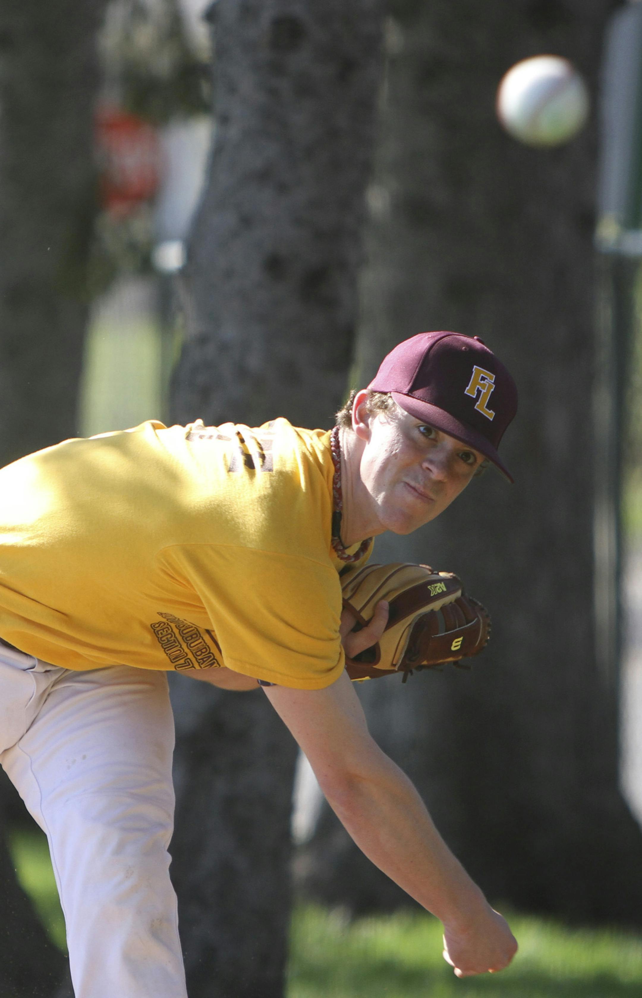 Senior pitcher Beau Fandel worked on his different pitches during the Forest Lake High School baseball team's practice in Forest Lake Min., Tuesday, March 31, 2012. ] (KYNDELL HARKNESS/STAR TRIBUNE) kyndell.harkness@startribune.com ORG XMIT: MIN2013040913040214