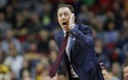 Gophers coach Richard Pitino directed his team during a first-round game against Louisville. Pitino signed an extension at season's end.