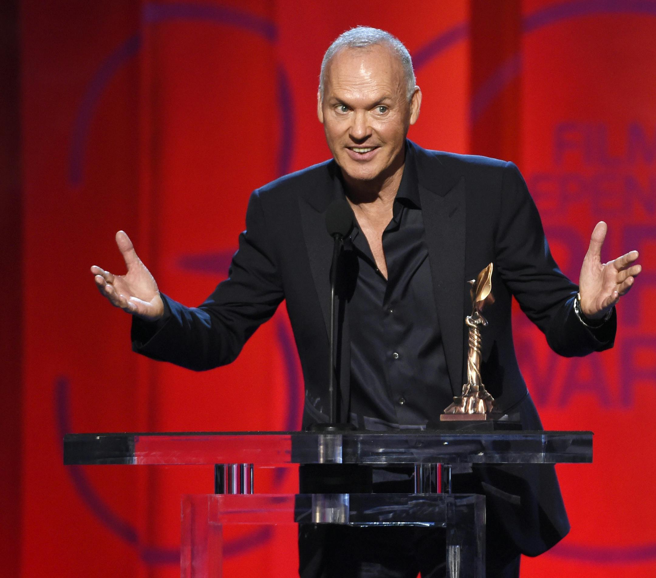 Michael Keaton accepts the award for best male lead for “Birdman or (The Unexpected Virtue of Ignorance)” at the 30th Film Independent Spirit Awards on Saturday, Feb. 21, 2015, in Santa Monica, Calif. (Photo by Chris Pizzello/Invision/AP)