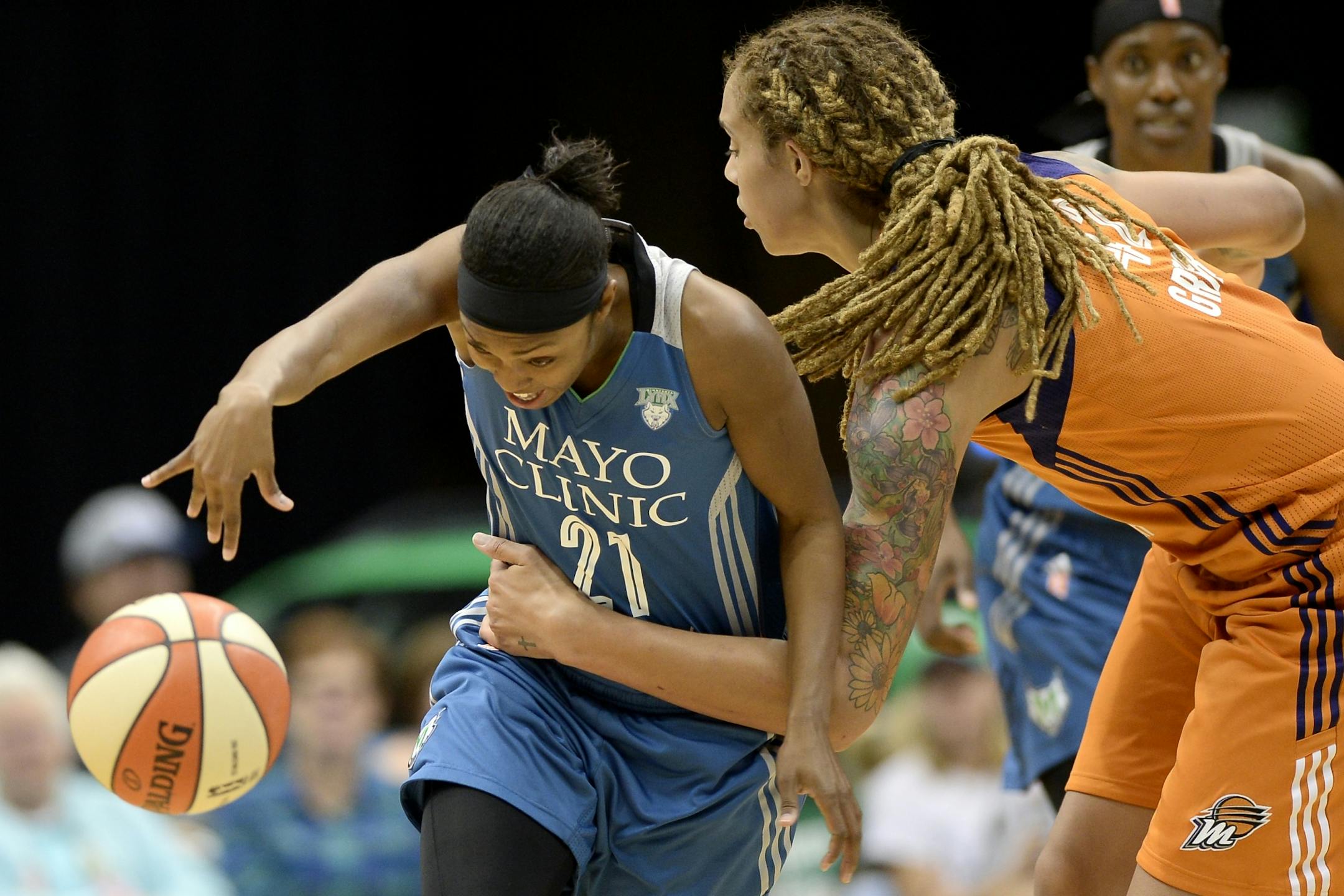 Phoenix Mercury center Brittney Griner (42) fouled Minnesota Lynx guard Renee Montgomery (21) and was called for a clear path violation in the second quarter Tuesday.