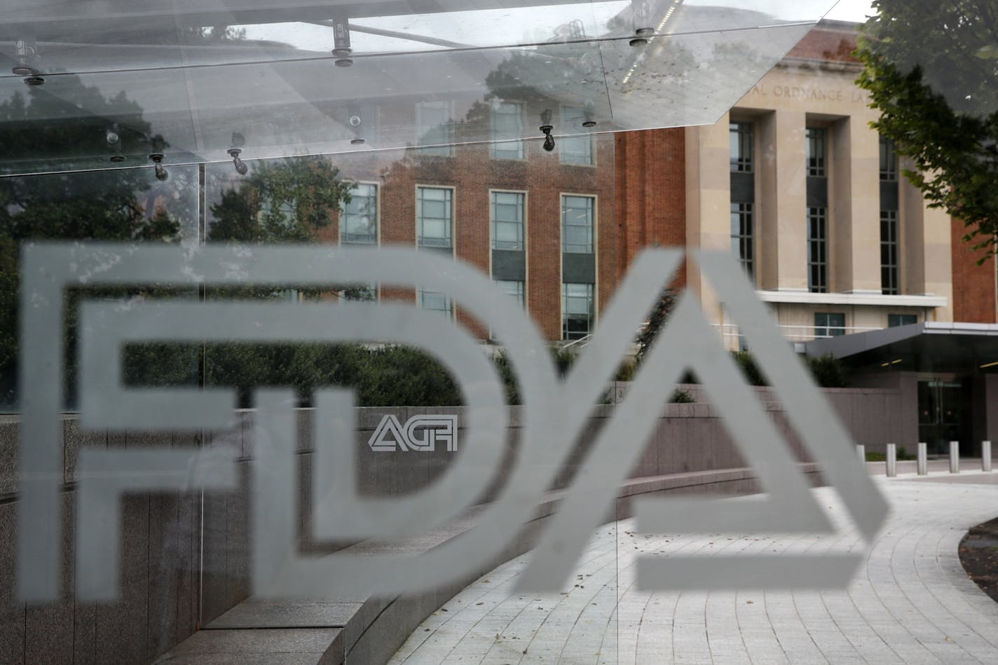 This 2018 fie photo shows the U.S. Food and Drug Administration building behind FDA logos at a bus stop on the agency's campus in Silver Spring, Md. (AP Photo/Jacquelyn Martin, File) ORG XMIT: MERd0e69ec144559a43c1794ee756276