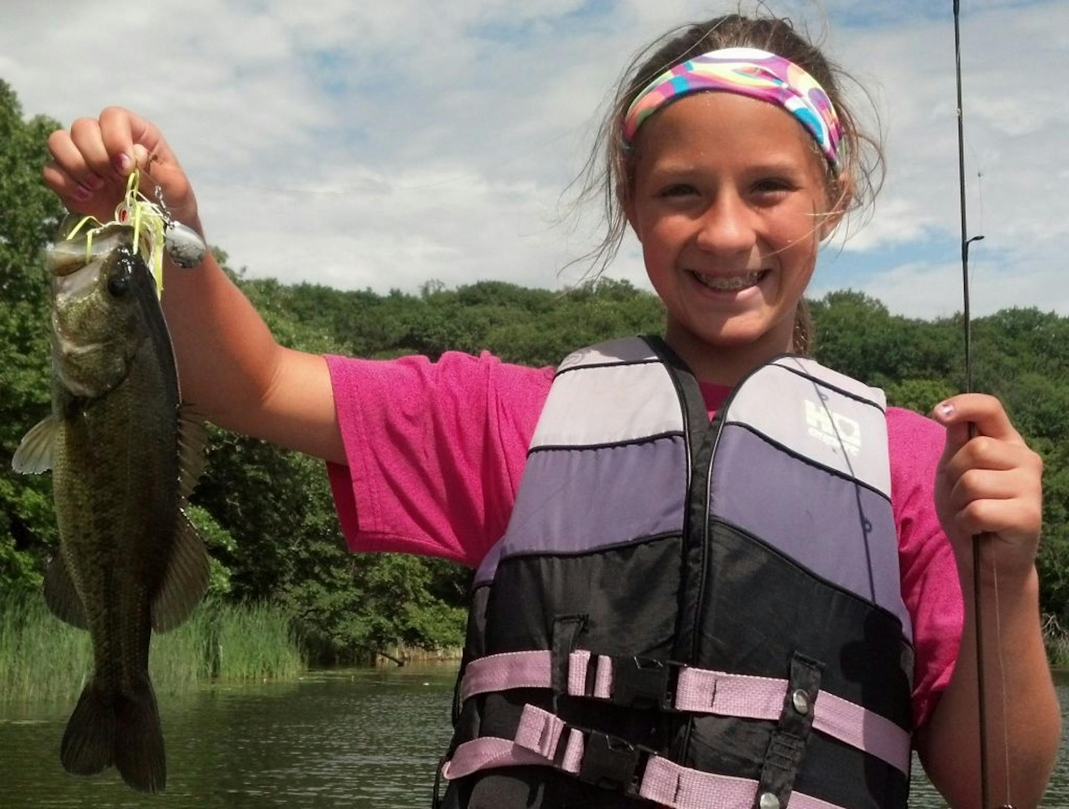 DAY OF FIRSTS Maddie Brandt, 12, of St. Bonifacious had a day of firsts recently on a west metro lake: The first time she used spinning gear (which she mastered quickly), fist time using artificial bait, first time fishing for bass and first time catching a bass. She and her grandpa and his fishing student friend caught seven bass, all released to be caught again.