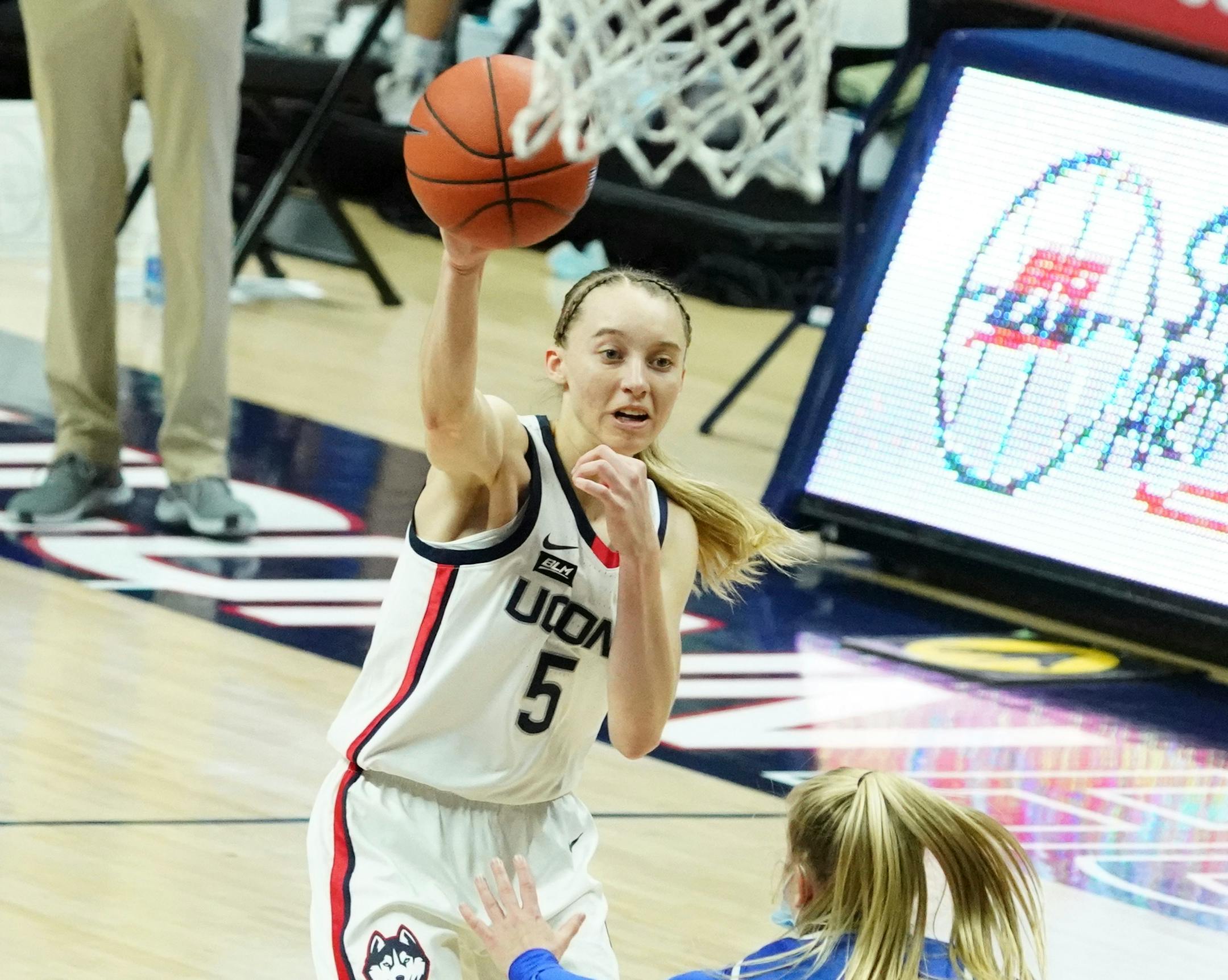 Connecticut guard Paige Bueckers passes the ball against Creighton in the second half Thursday