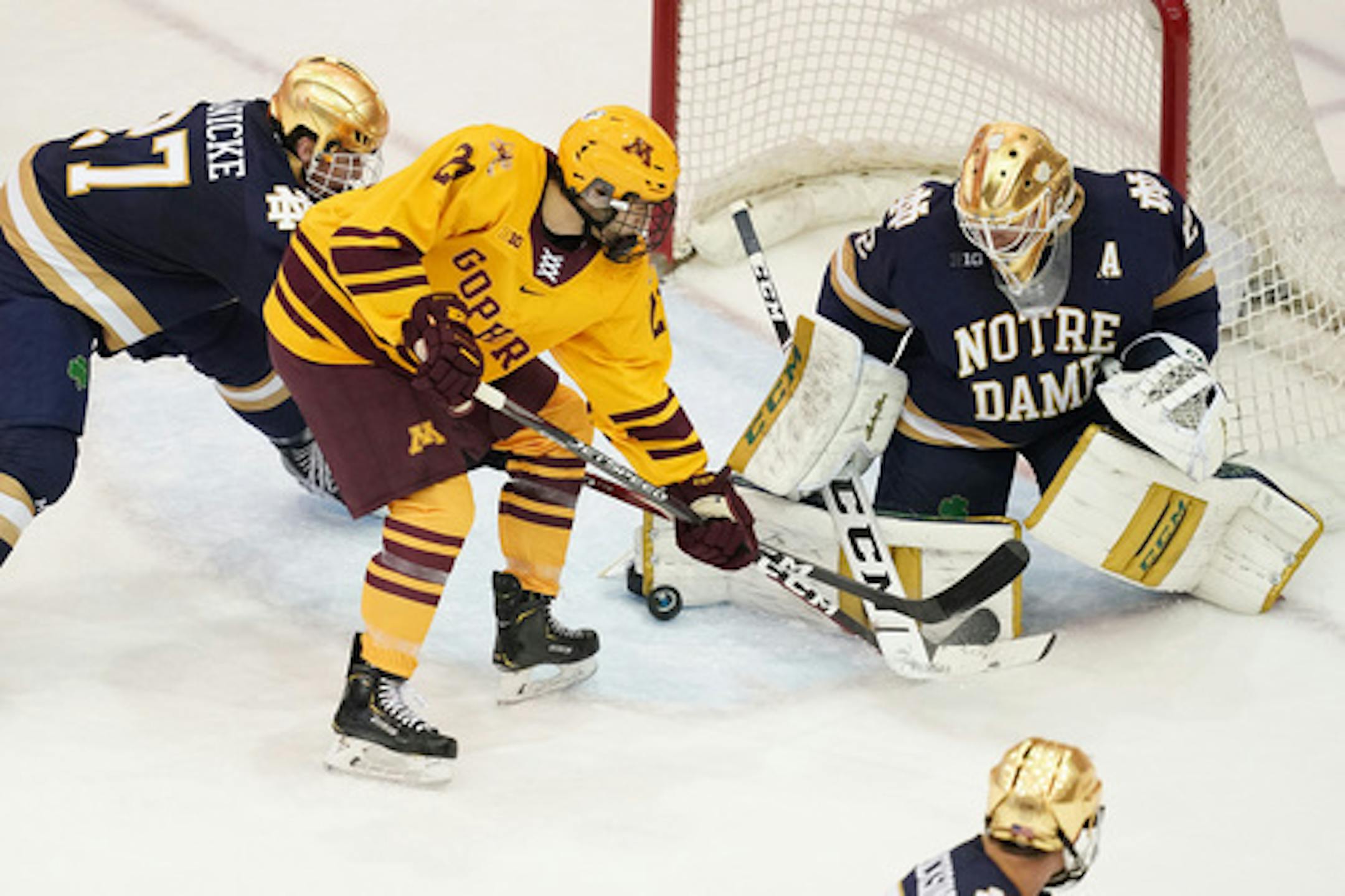 Nathan Burke, center, and the Gophers face Notre Dame and goalie Cale Morris in the Big Ten quarterfinal series this weekend.