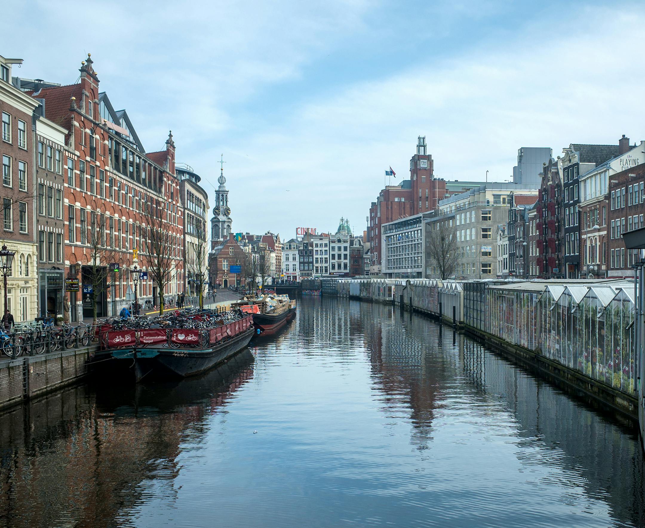 My name is Derek Meyer from Orono. I took a weekend trip to Amsterdam (from my home base of Trinity College Dublin for the semester) and as I was crossing one of the many canals (the Singel) and this scene struck me enough to take a picture. To the right is the Bloemenmarkt (Flower Market) which is the only floating flower market in the world and on the left is a boat used to store bikes for tourists. Amsterdam is known as the city of bikes but they are also well known for their canals and vario