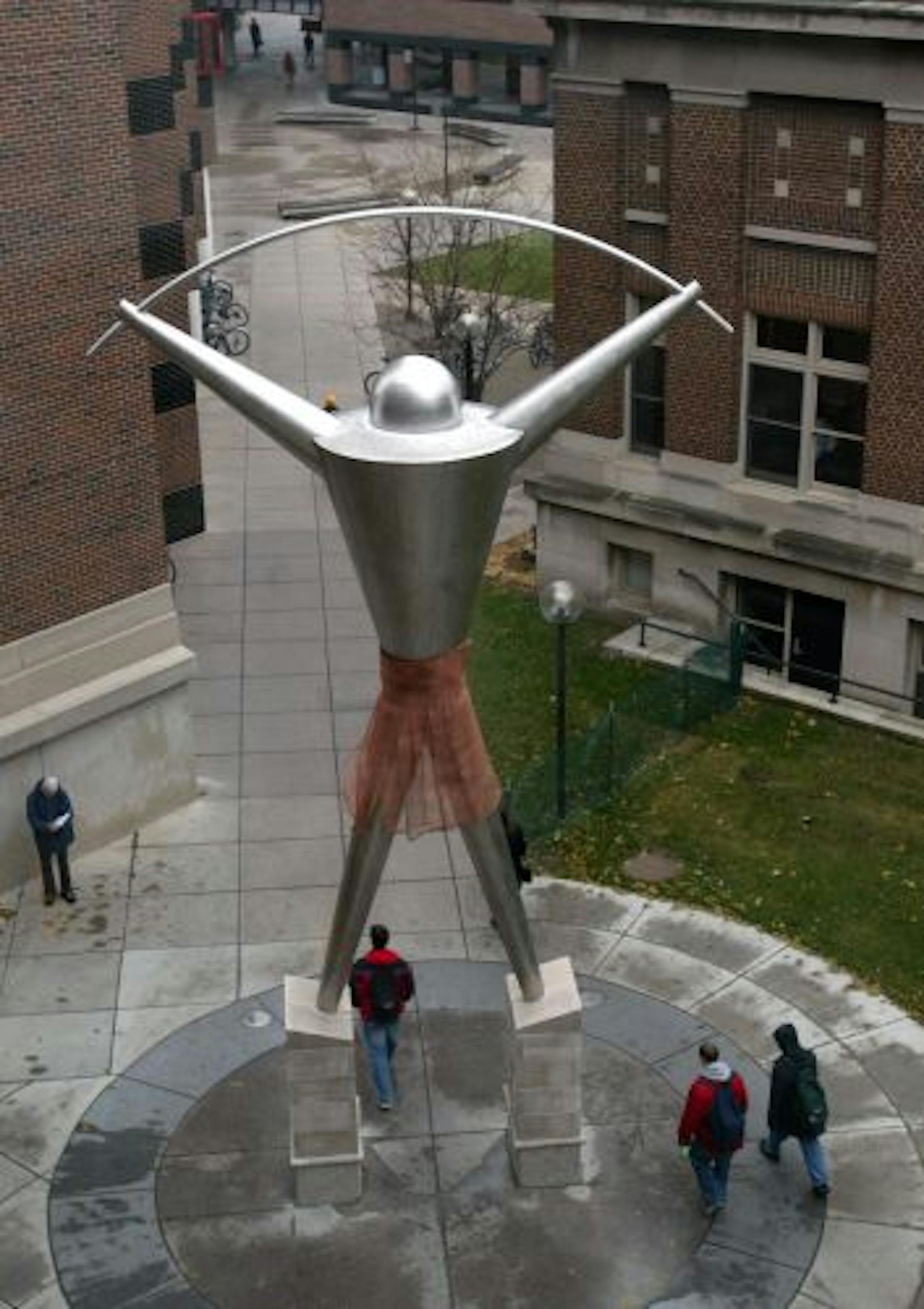 " Platonic Figure" by Andrew Leicester, a 28 ft sculpture at the U of M engineering plaza, now sporting a copper mesh skirt.