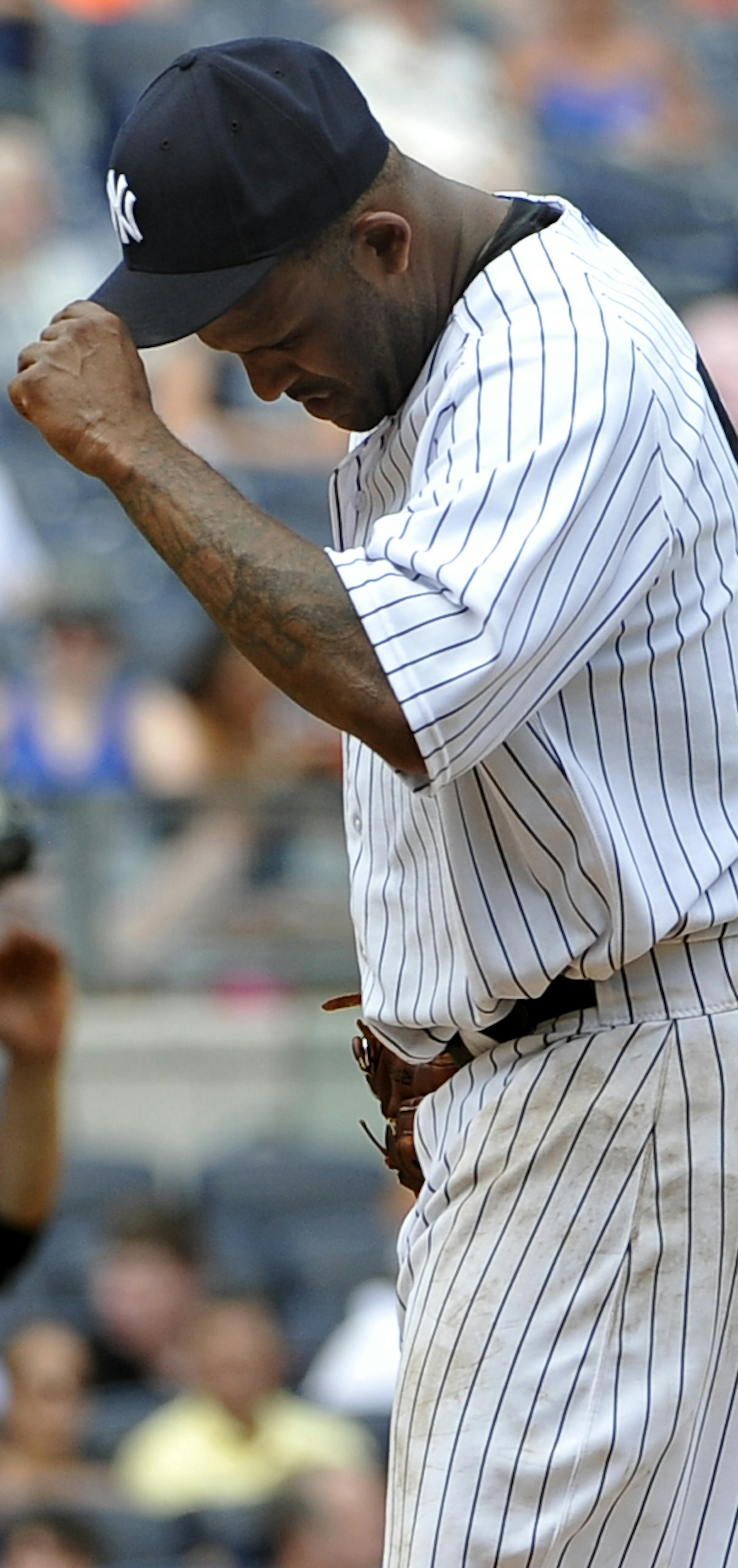 New York Yankees starting pitcher CC Sabathia paueses on the mound after he loaded the bases by walking Minnesota Twins' Joe Mauer in the fourth inning of a baseball game at Yankee Stadium on Sunday, July 14, 2013 in New York. (AP Photo/Kathy Kmonicek)