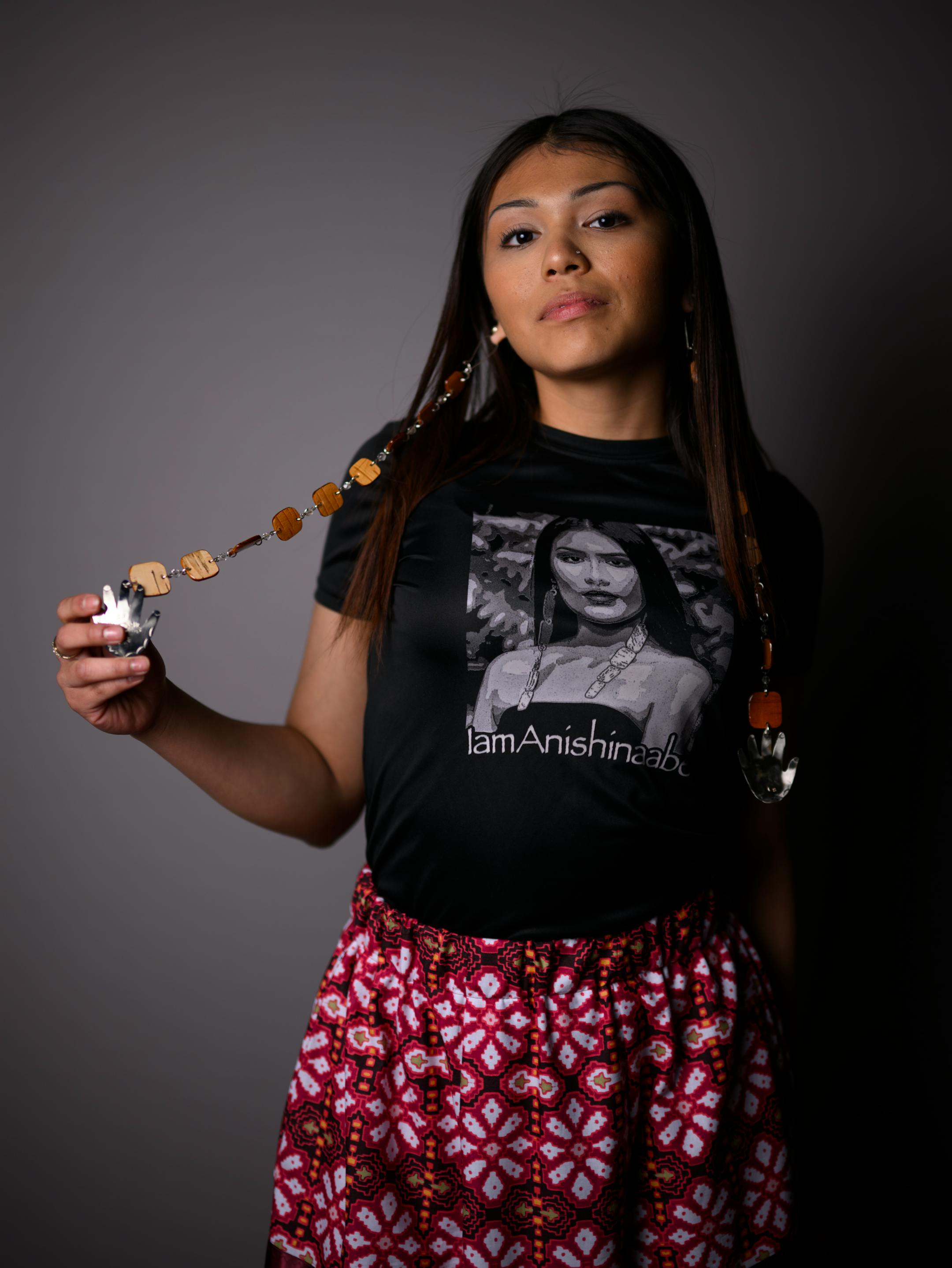 Deer Lake High School student Alyssa Cronin, 17, from the Leech Lake Reservation, stands for a portrait during "Northern Lights: A Native Nations Fashion Night." Cronin is part of the Anishinaabe Education Leadership Group and worked on designing and producing apparel with artist Delina White of "IamAnishinaabe."