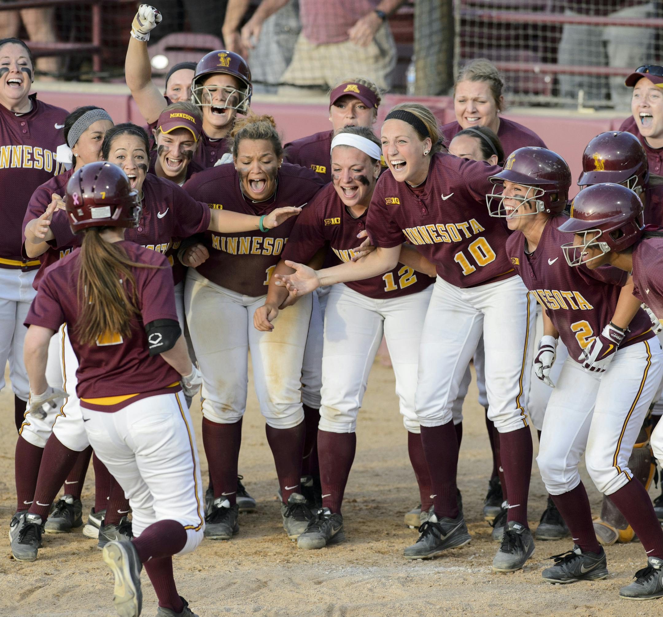 Teammates greeted Sam Macken at home plate after her three-run home run in the sixth inning gave the Gophers the lead in their NCAA regional tournament final against Auburn at Jane Sage Cowles Stadium on Sunday.