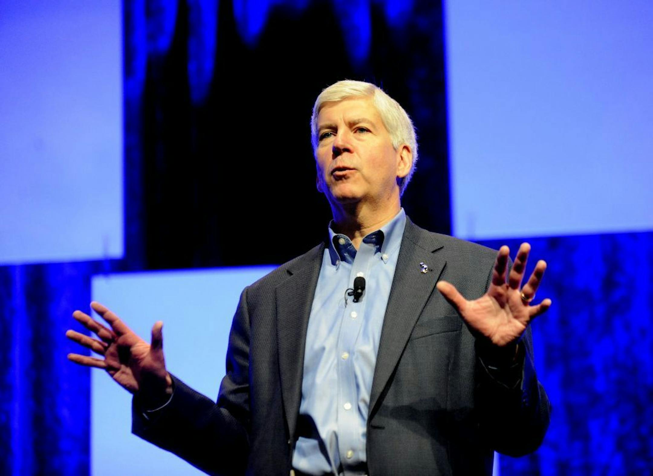 Gov. Rick Snyder speaks at The North American International Cyber Summit, Michigan's third summit to address cyber security issues in government, business and other sectors, at Cobo Center in Detroit on Monday, Nov. 17, 2014. Experts from across the country are discussing trends and best practices Monday at the North American International Cyber Summit at Cobo Center in Detroit.