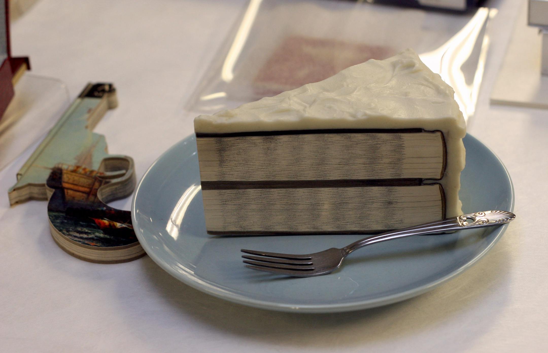 Walker Art Center " Books" exhibition, - piece of cake and gun shaped ' History of the United States" by Robert The.