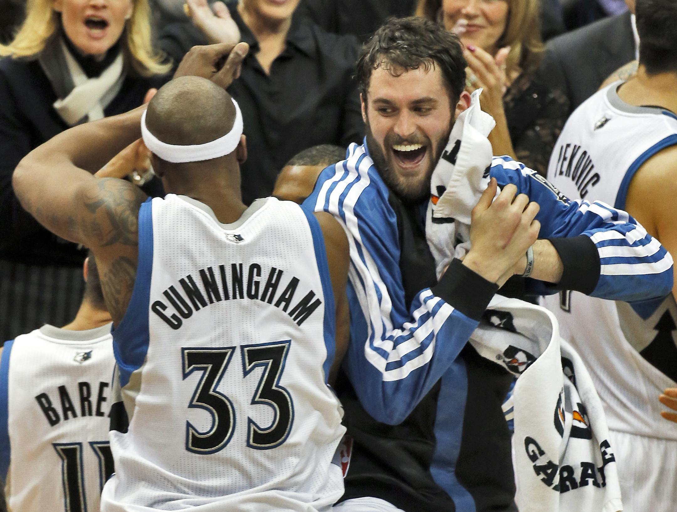 Minnesota Timberwolves vs. Philadelphia 76ers. Minnesota won 106-99. Wolves Dante Cunningham and Kevin Love did a victory dance courtside. (MARLIN LEVISON/STARTRIBUNE(mlevison@startribune.com)