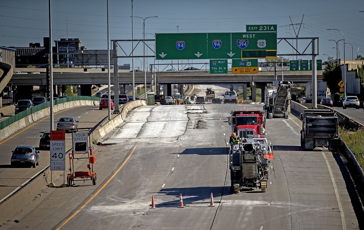 Crews worked on Interstate 94 leading into the Lowry Hill tunnel in 2017. The Minnesota Department of Transportation has been updating signs for exit-only lanes as it carries out new work.