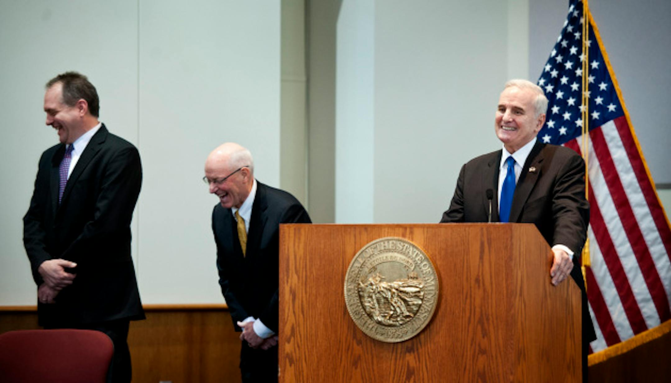 Governor Dayton said raising taxes on clothes goes against his upbringing.  Governor Mark Dayton unveiled his budget proposal Tuesday, January 22, 2013.  This is the first time he has appeared in public since his back surgery.  He will be joined by Commissioner Jim Schowalter, Commissioner Myron Frans.   ]   GLEN STUBBE * gstubbe@startribune.com  EDS:  Franz has white hair yellow tie, schowalter dark hair dark tie.
