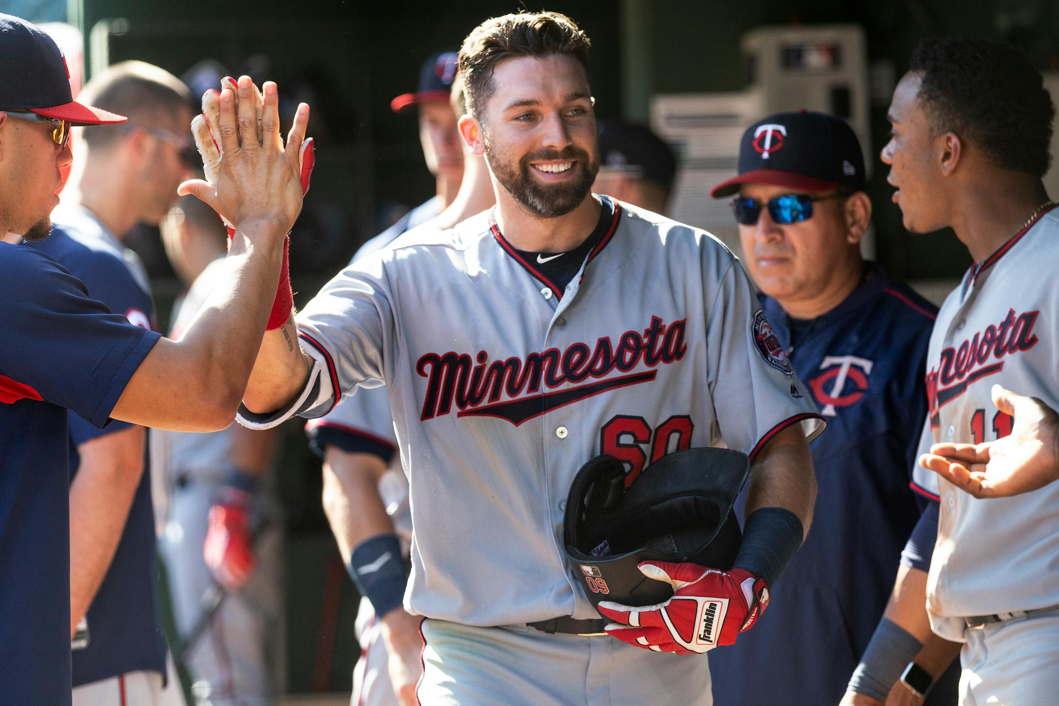 Jake Cave was all smiles after hitting a home run in September, and this week tried Spam for the first time at the home of the product in Austin, Minn. He called the canned meat "all right."