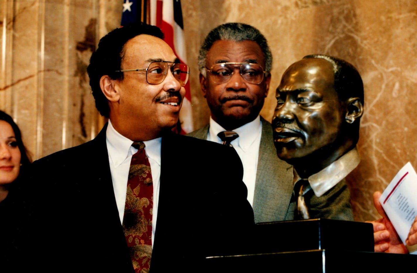 Former St. Paul Council Member Bill Wilson, left, and Rev. James Battle, center, watched as a bronze bust of Dr. Martin Luther King was unveiled during a ceremony at the St. Paul City Hall in 1994.