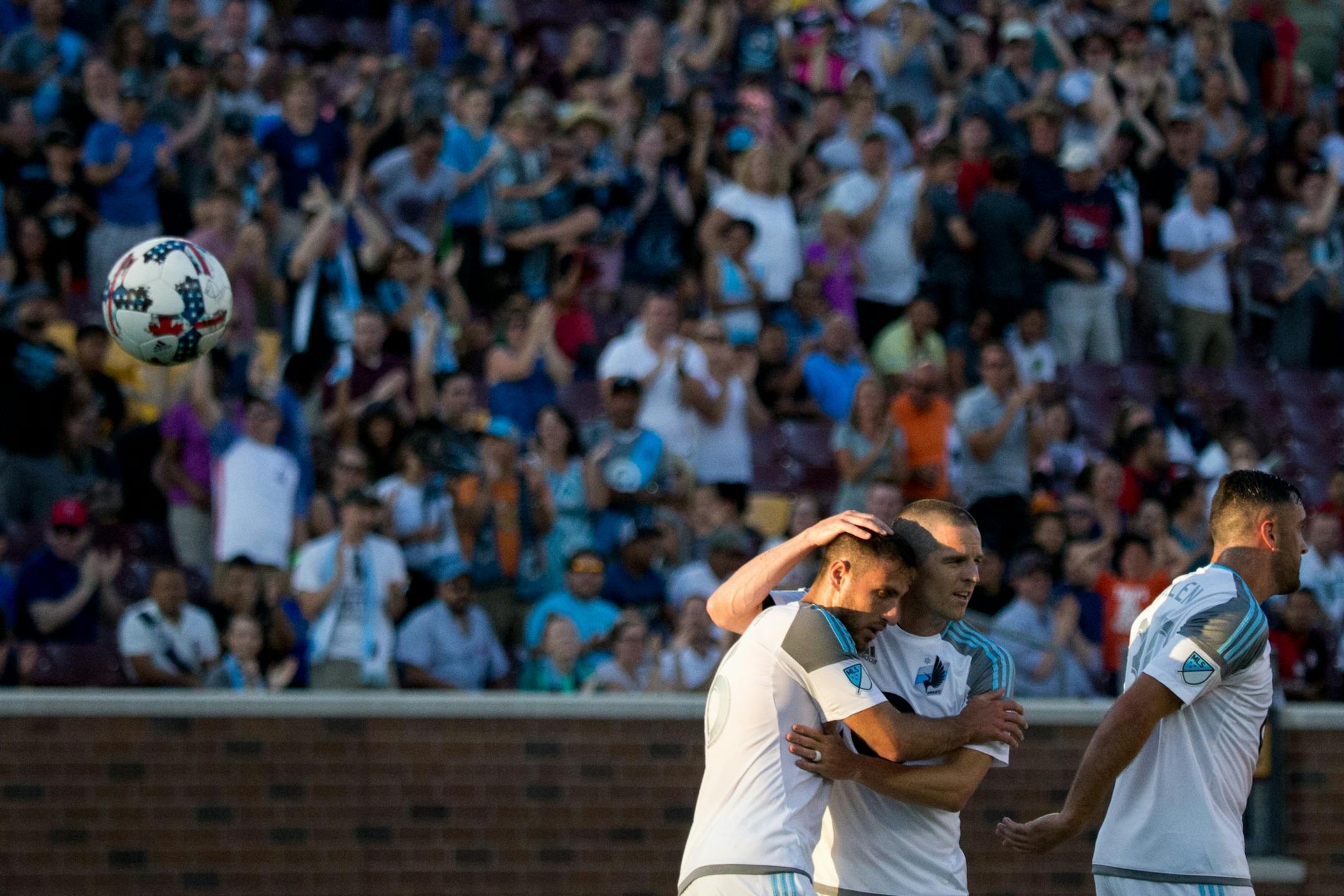 Minnesota United�s Sam Cronin (second from right) hugs Bashkim Kadrii after he scores a goal in the first half against Atlas on Saturday, July 15, 2017, at TCF Bank Stadium.