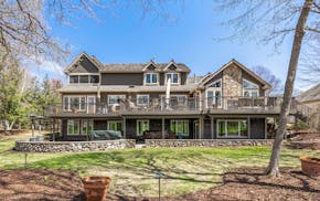 A house in Chaska that stands near to the Hazeltine National Golf Club, with big deck and expansive views, is listed for about $1.6 million.