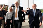 WikiLeaks founder Julian Assange, center, arrives at the United States courthouse where he is expected enter a plea deal, in Saipan, Mariana Islands, 