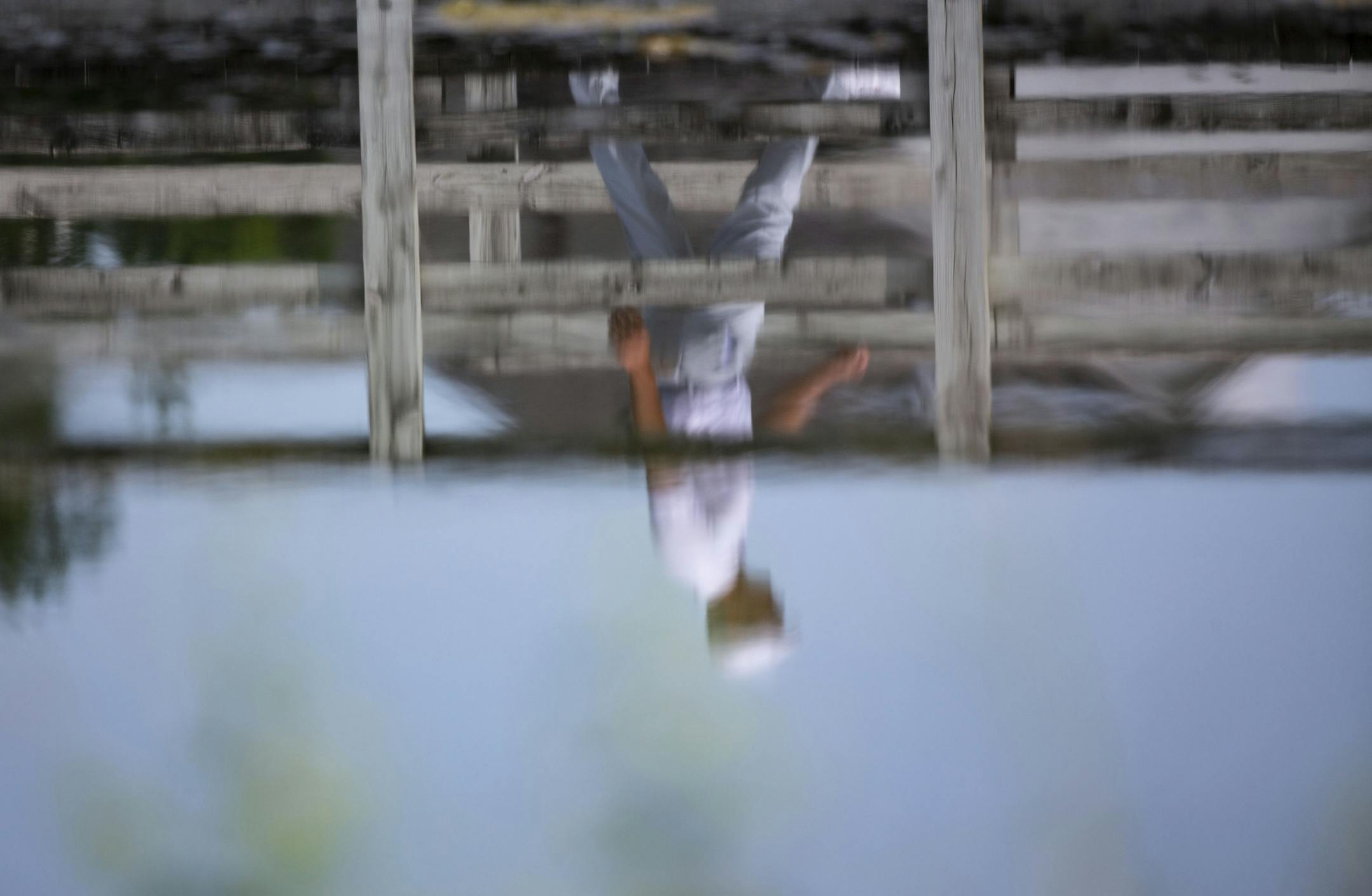 Bryson DeChambeau is reflected as he crosses a bridge after the second hole. ALEX KORMANN ¥ alex.kormann@startribune.com Competitors for the 3M Open took to the course on Saturday.