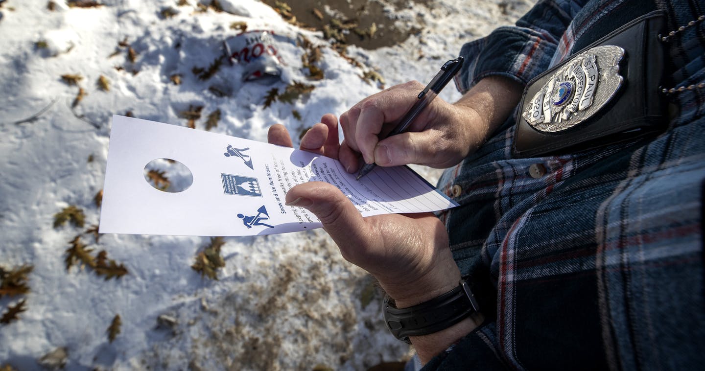 A St. Paul code inspector spent a December day investigating snow removal violations. in St. Paul.