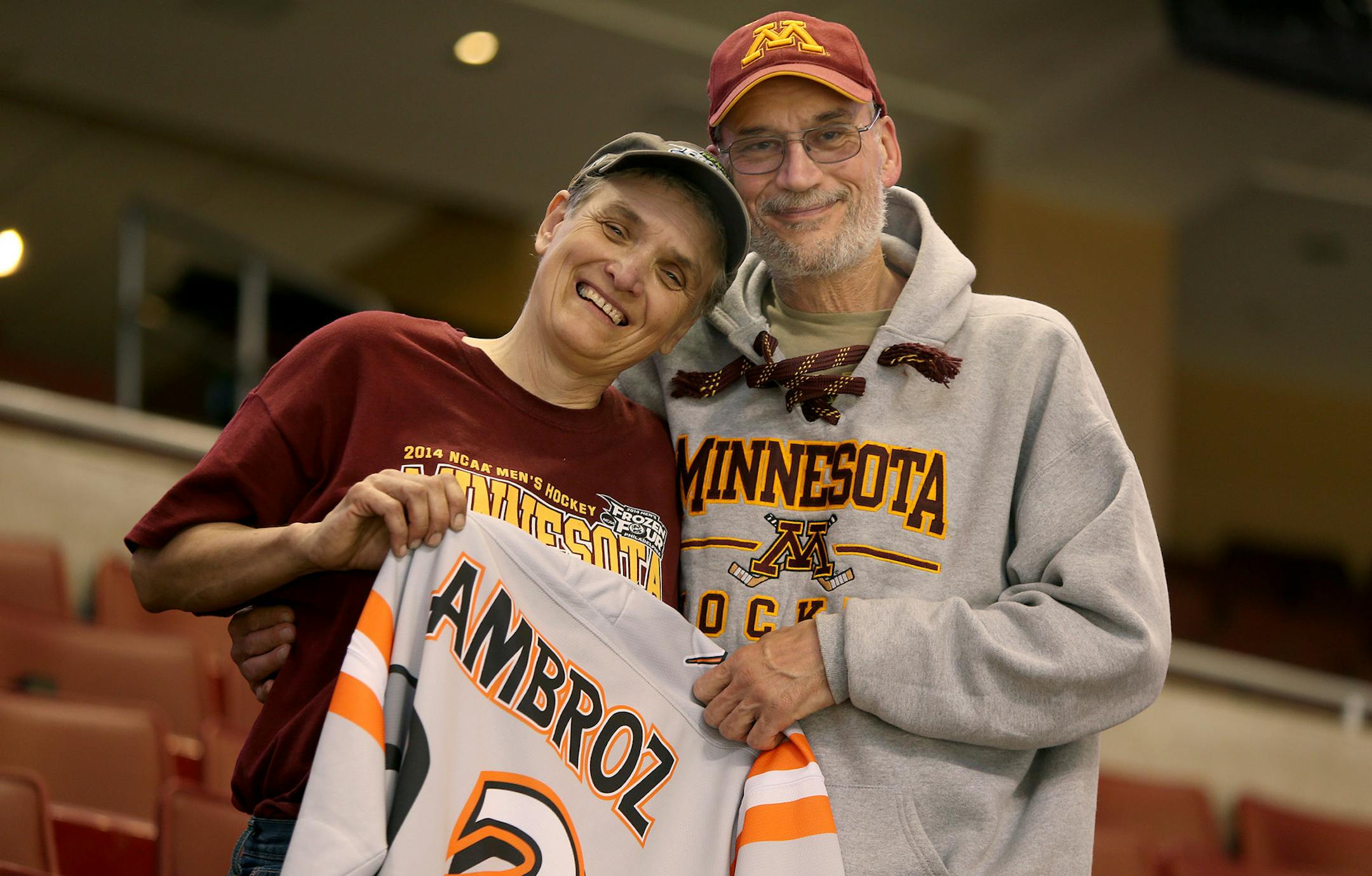 Bob and Sue Ambroz proudly held their son's high school jersey as they were happy to be at the Wells Fargo Center to see their son Seth Ambroz play in the final game of the Frozen Four in Philadelphia, PA, Saturday, April 12, 2014. ] (ELIZABETH FLORES/STAR TRIBUNE) ELIZABETH FLORES • eflores@startribune.com