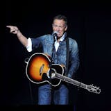 FILE - In this Nov. 5, 2018 file photo, Bruce Springsteen performs at the 12th annual Stand Up For Heroes benefit concert at the Hulu Theater at Madison Square Garden in New York. Springsteen surprised moviegoers by introducing his new concert film in his New Jersey hometown. The Asbury Park Press reports Springsteen introduced two showings of "Western Stars" at the AMC Loews Freehold Metroplex Cinema in Freehold on Saturday, Oct. 19, 2019.