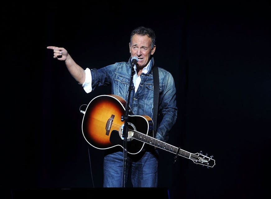 FILE - In this Nov. 5, 2018 file photo, Bruce Springsteen performs at the 12th annual Stand Up For Heroes benefit concert at the Hulu Theater at Madison Square Garden in New York. Springsteen surprised moviegoers by introducing his new concert film in his New Jersey hometown. The Asbury Park Press reports Springsteen introduced two showings of "Western Stars" at the AMC Loews Freehold Metroplex Cinema in Freehold on Saturday, Oct. 19, 2019.