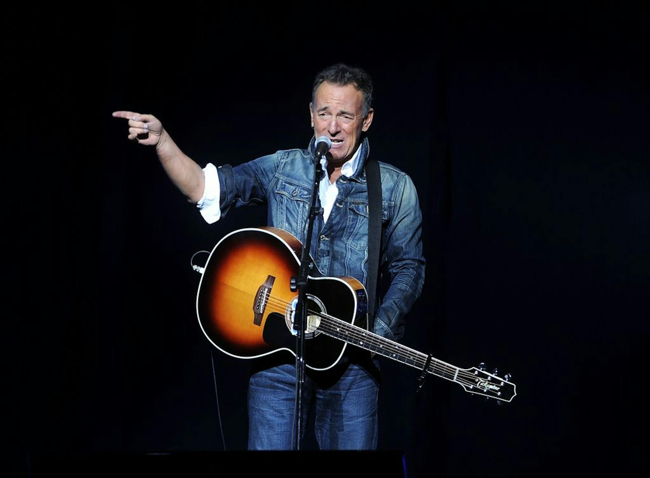 FILE - In this Nov. 5, 2018 file photo, Bruce Springsteen performs at the 12th annual Stand Up For Heroes benefit concert at the Hulu Theater at Madison Square Garden in New York. Springsteen surprised moviegoers by introducing his new concert film in his New Jersey hometown. The Asbury Park Press reports Springsteen introduced two showings of "Western Stars" at the AMC Loews Freehold Metroplex Cinema in Freehold on Saturday, Oct. 19, 2019.