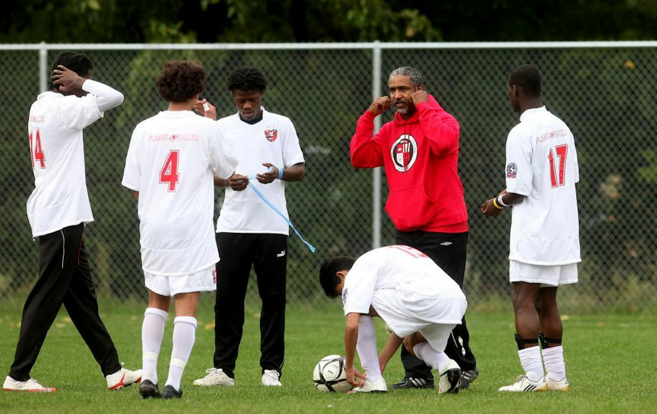 In this file photo from 2010, Prairie Seeds Academy head coach Youssef Darbaki prepares his team for a regular-season game. On Wednesday, the MSHSL disqualified the school from this year's Class 1A boys' soccer tournament for using an ineligible player.
