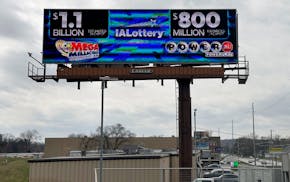 An electronic billboard advertises the Mega Millions and Powerball jackpots, Monday, March 25, 2024, in Des Moines. On Tuesday, someone who bought a