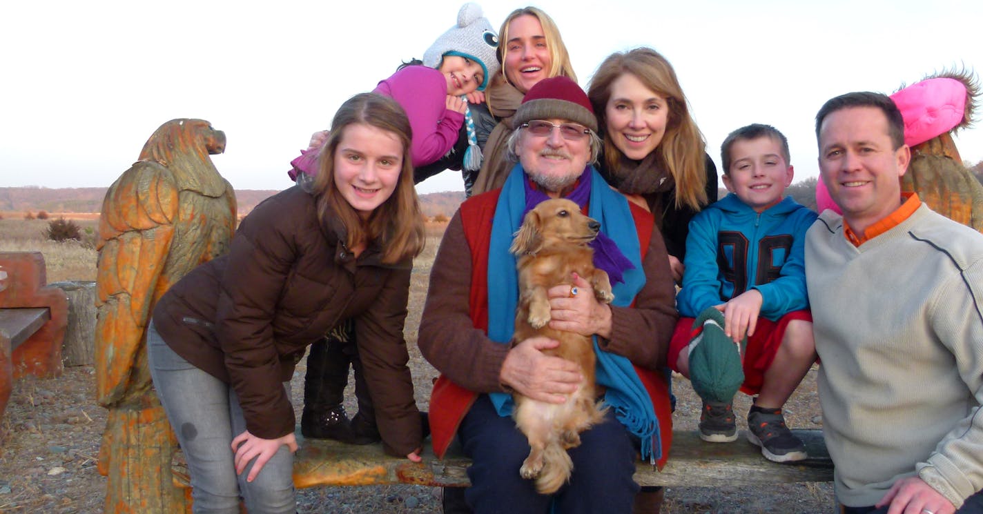 Rechelbacher's father, Horst, is surrounded by family in a personal photo; with Nicole at top center.