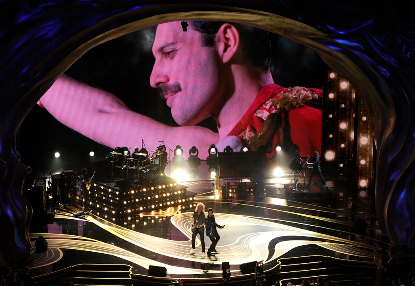 With an image of Freddie Mercury behind them, Brian May and Adam Lambert of Queen performed at the Oscars.