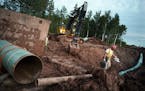 Workers have built the Wisconsin portion of a proposed Enbridge pipeline that would run across northern Minnesota.