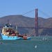 FILE- In this Sept. 8, 2018 file photo, a ship tows The Ocean Cleanup's first buoyant trash-collecting device toward the Golden Gate Bridge in San Fra