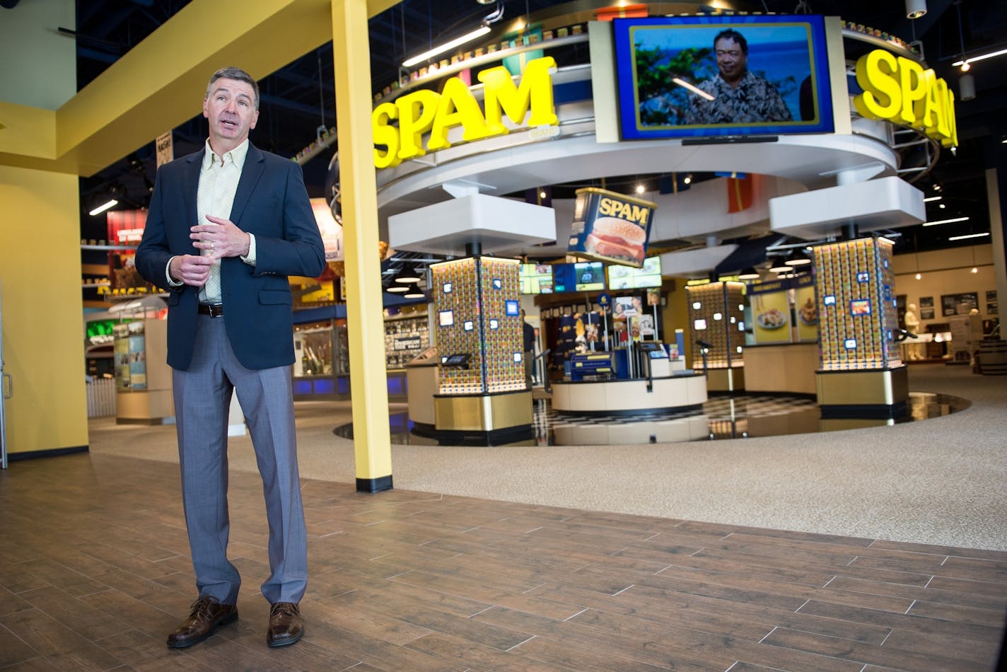 Jim Snee, president of Hormel, spoke to the media in front of "Can Central" near the entrance of the Spam Museum Thursday.