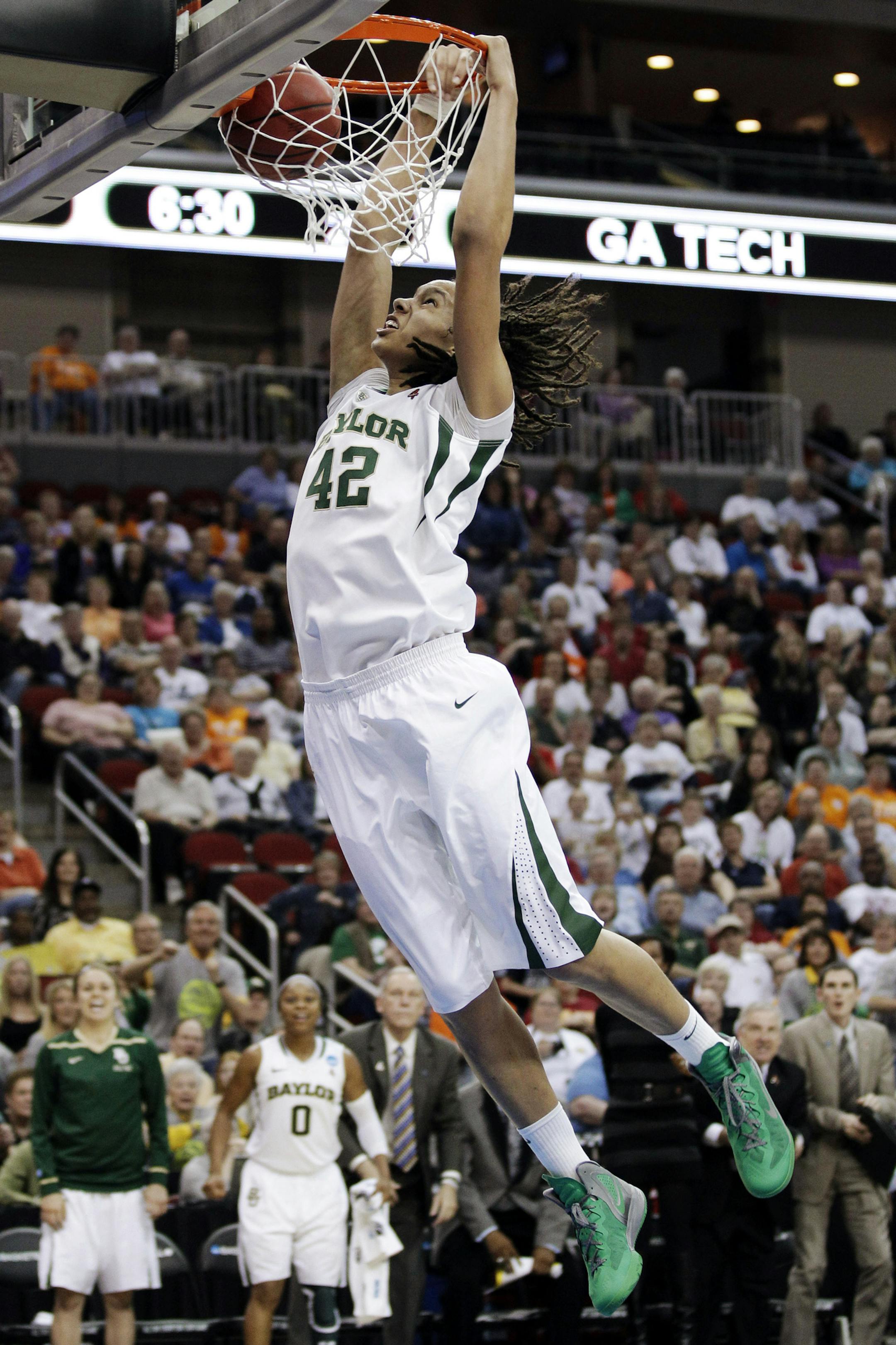 FILE - In this March 24, 2012, file photo, Baylor center Brittney Griner dunks the ball during the second half of an NCAA women's tournament regional semifinal college basketball game against Georgia Tech in Des Moines, Iowa. President Barack Obama is going with Griner and Baylor to win back-to-back titles in the NCAA women's basketball tournament. Obama's pick was announced Friday, March 22, 2013 on ESPN. (AP Photo/Charlie Neibergall, File) ORG XMIT: NY158