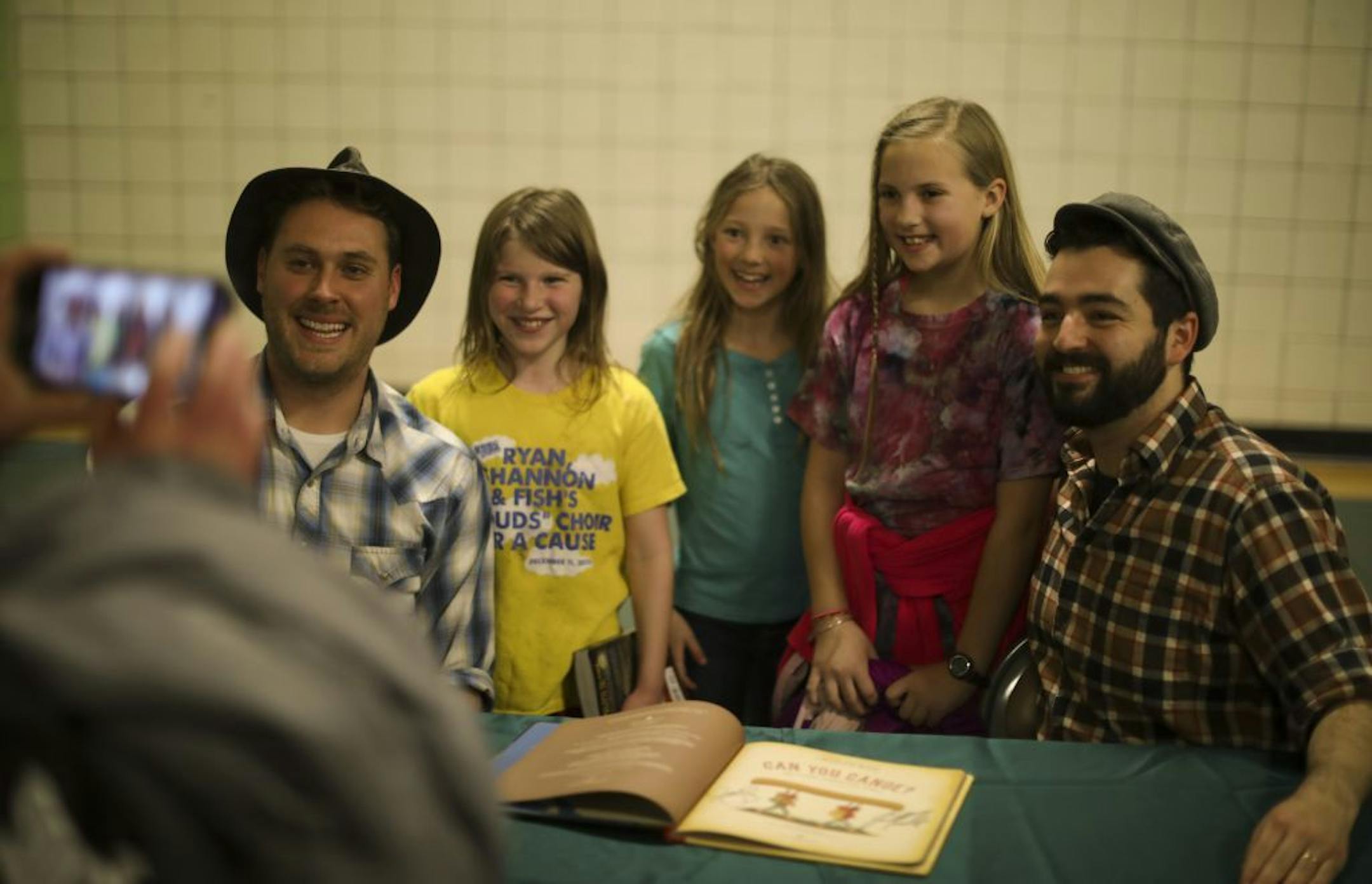 The Okee Dokee Brothers posed for a photo with three of their fans after a recent show.