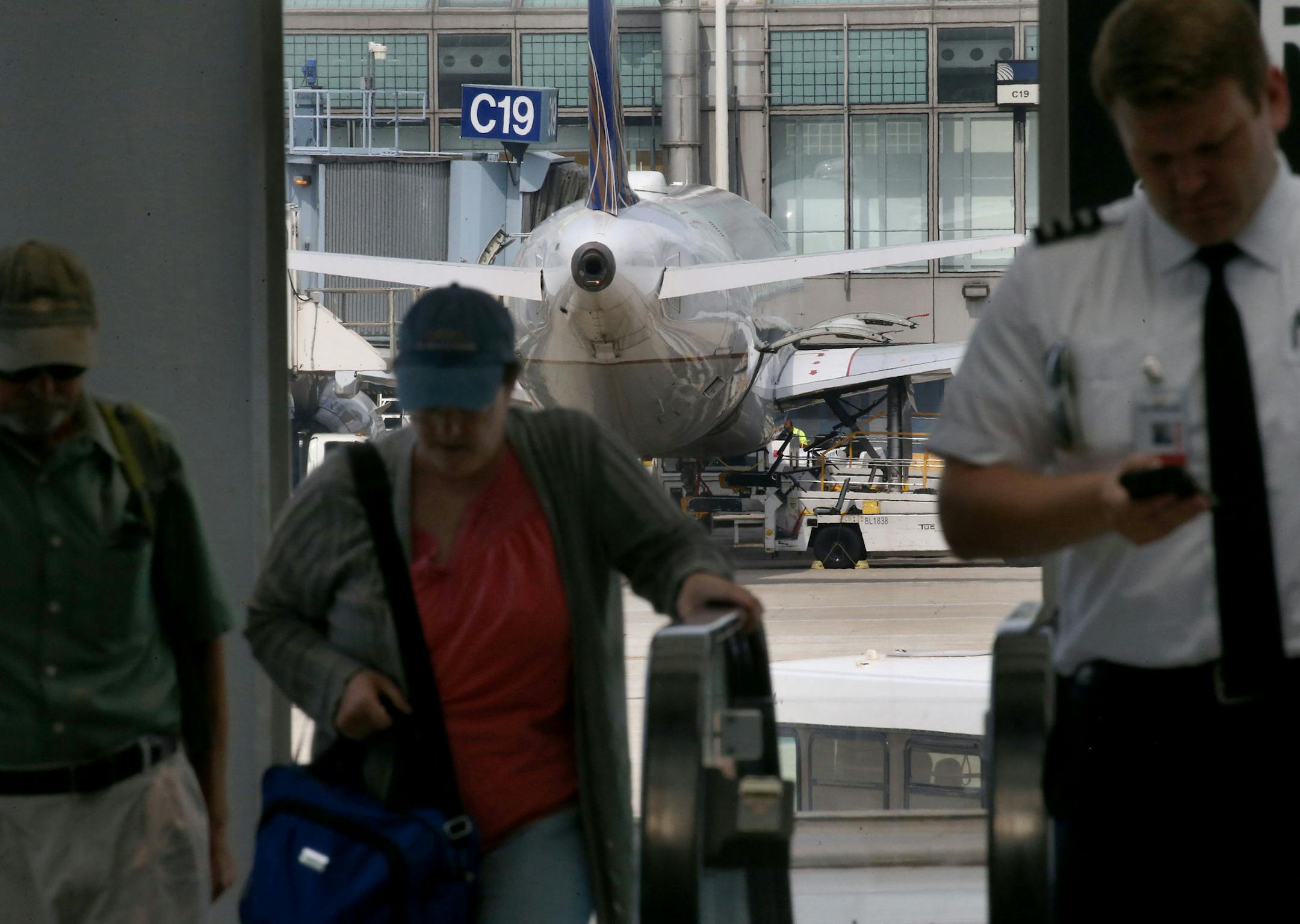 Airline travelers at the United Airlines terminal at O'Hare International Airport on Thursday, July 12, 2018. Airlines are mining data to improve flights. United has reduced preventable damage to aircraft and injuries to workers by mapping where damage and injuries occur and identifying problems spots. (Antonio Perez/Chicago Tribune/TNS)