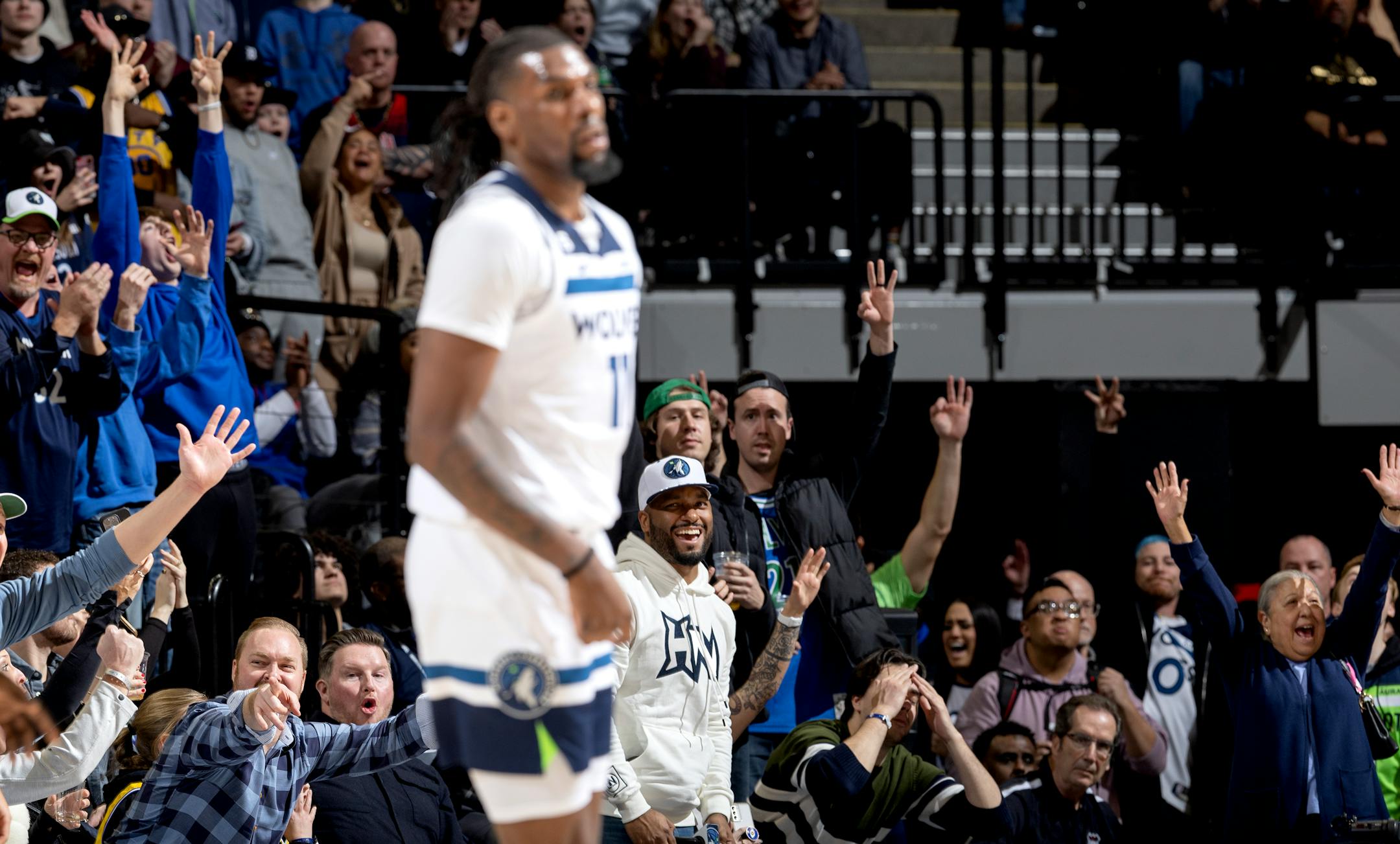 Fans celebrate a three pointer by Naz Reid (11) of the Minnesota Timberwolves late in the fourth quarter Wednesday, February 1, 2023, at Target Center in Minneapolis, Minn. ] CARLOS GONZALEZ • carlos.gonzalez@startribune.com.