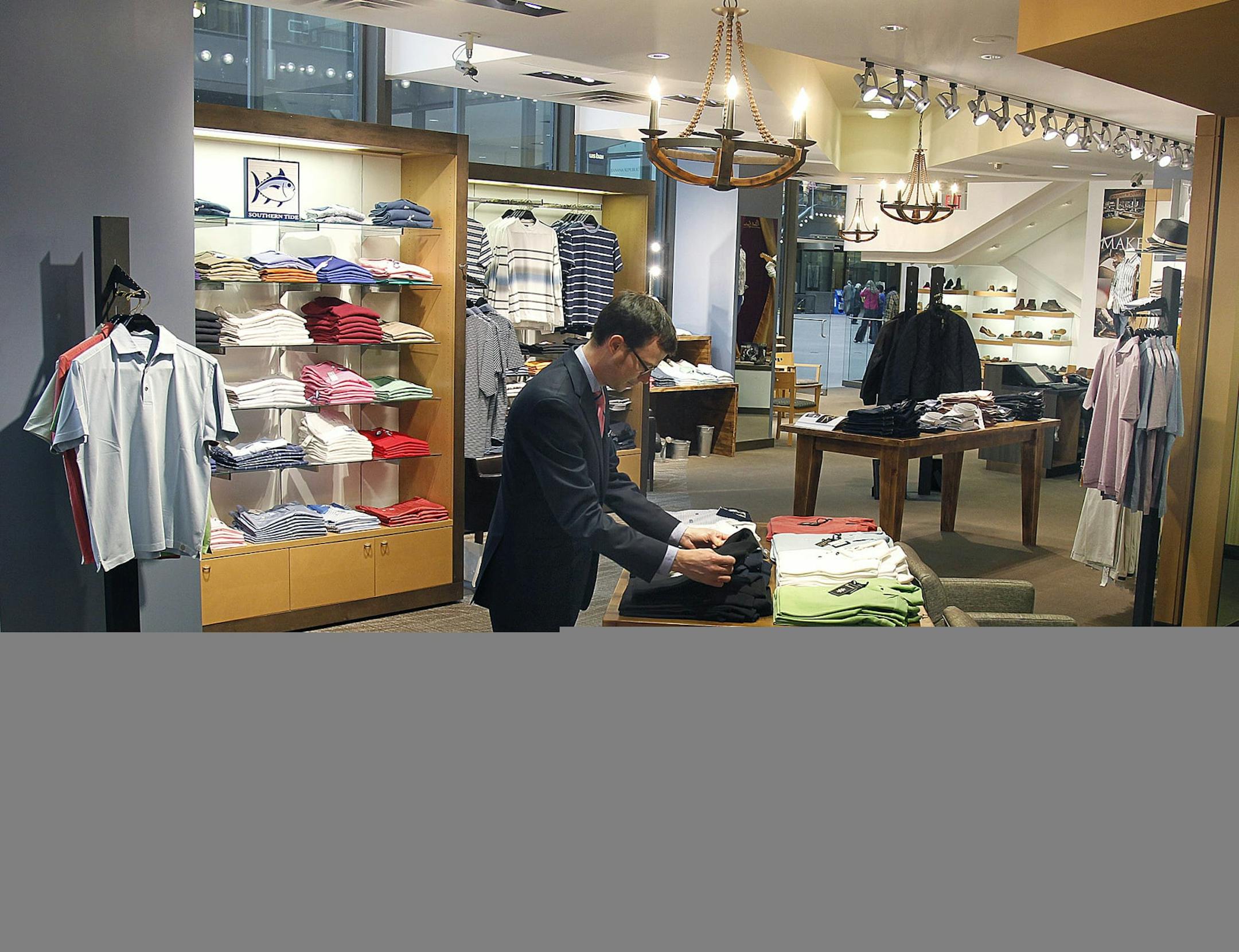 Matt White worked in the recently renovated area at the Hubert White men's boutique in the IDS Center, Tuesday, May 14, 2013. Matt's father, Bob White, is the owner and grandson of founder Hubert White. (ELIZABETH FLORES/STAR TRIBUNE) ELIZABETH FLORES • eflores@startribune.com