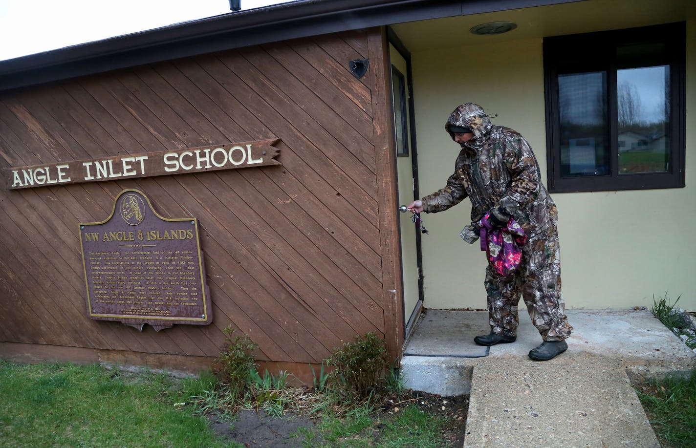 Angle Inlet School teacher Linda LaMie opens up her oneroom school for the day Tuesday, May 12, 2015, in Angle Inlet, MN. LaMie lives with her husband in a cabin near no roads, on the edge of a river and accessible only by boat during open water. On this day, LaMie and her husband experienced motor issues and Linda was nearly late for school for what would have been the second time in her near 30 year-career.](DAVID JOLES/STARTRIBUNE)djoles@startribune.com For three decades, Linda LaMie has been