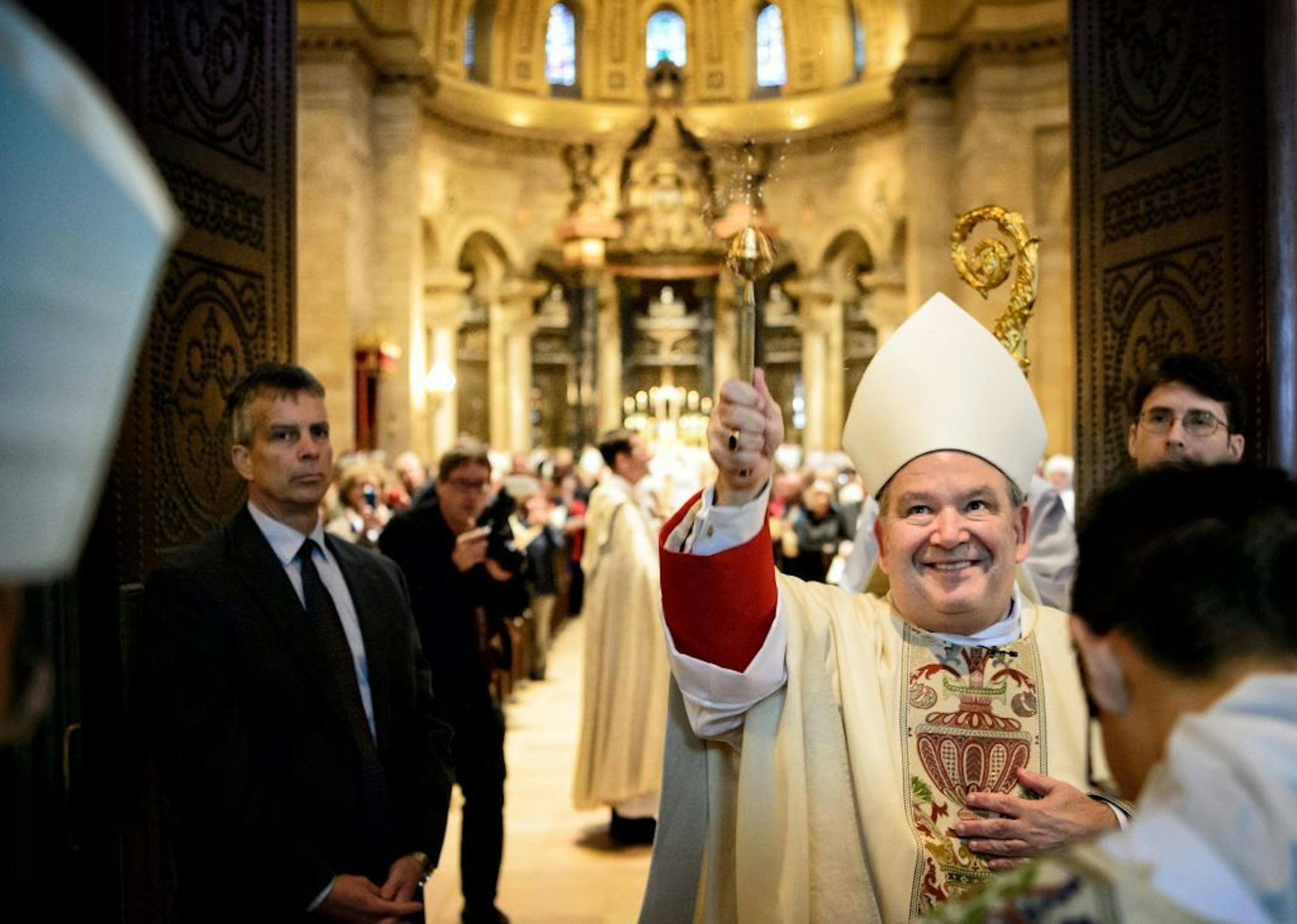 Archbishop Bernard Hebda blessed those gathered as he prepared to enter the cathedral.