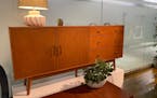 Midcentury-modern-inspired pieces like this sideboard continue to grace new home furnishing collections.
