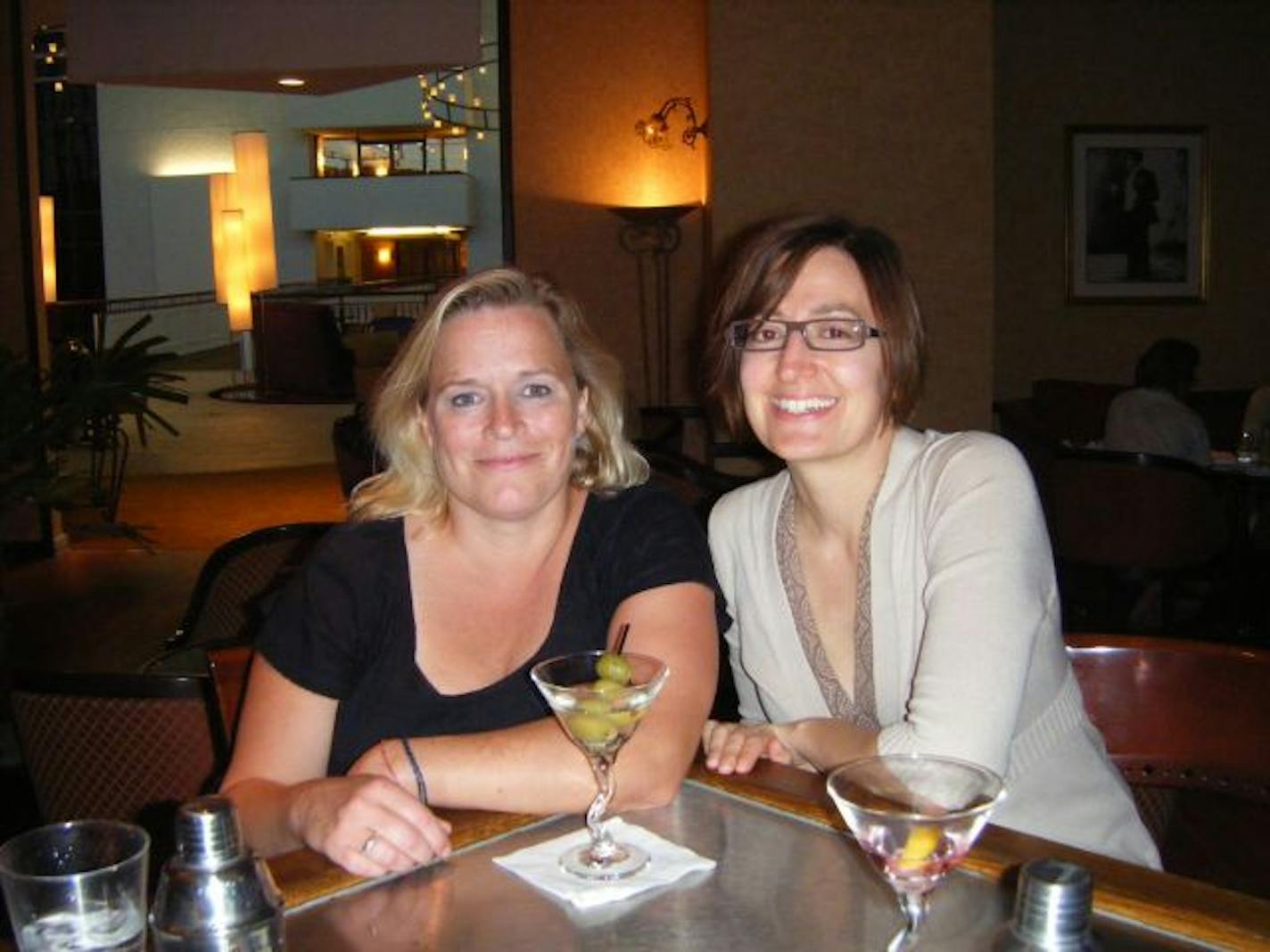 Rochelle Olson, left, and her friend Lisa Middag share a drink at Le Bar at Sofitel in Bloomington on Aug. 23 to steel themselves for their class reunion.