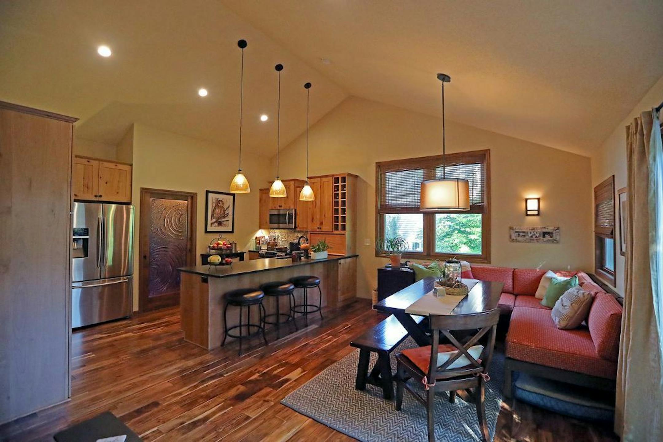 The Ayottes removed a wall separating their kitchen from their dining room, and added a dining banquette at right.