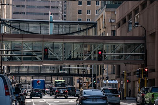 A skyway is visible above a street in downtown Minneapolis on July 31, 2023.