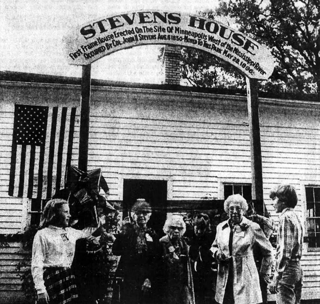 Three women who helped move the Stevens House as children cut the ribbon for the structure's restoration in 1982, alongside two of Stevens' great-great-great grandchildren. This photo is from a newspaper clipping -- the original could not be located.
