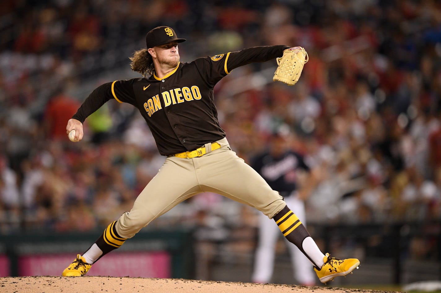 FILE - San Diego Padres starting pitcher Chris Paddack delivers a pitch during a baseball game against the Washington Nationals, Friday, July 16, 2021, in Washington. The Minnesota Twins acquired right-handed pitchers Chris Paddack and Emilio Pagán from the San Diego Padres for All-Star left-handed pitcher Taylor Rogers and outfielder Brent Rooker, Thursday, April 7, 2022. (AP Photo/Nick Wass, File)