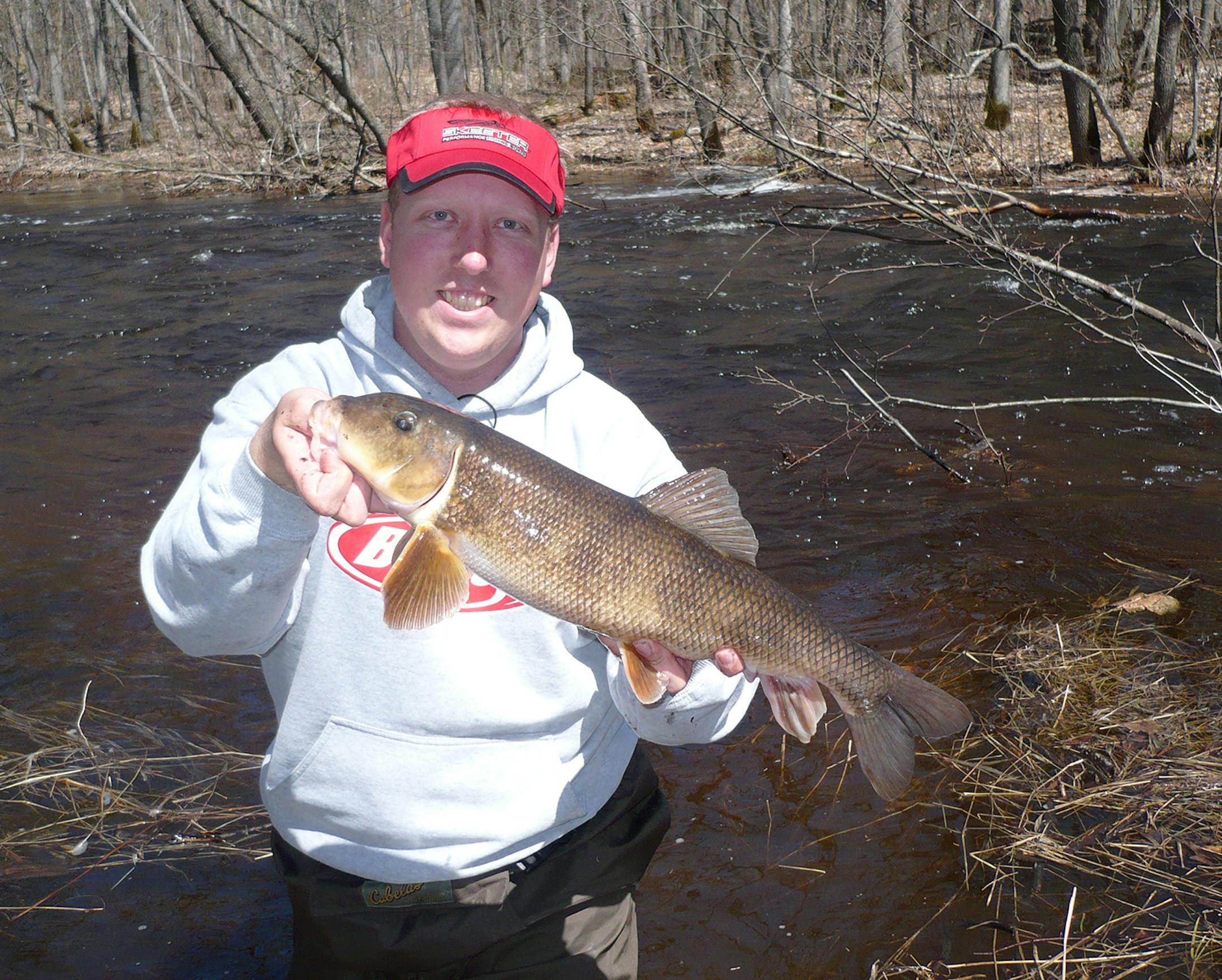 Adam Johnson with a sucker from the Nokassippi River.